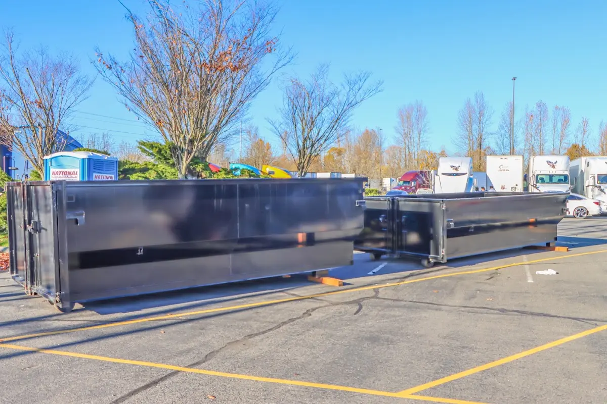 Professional dumpster rental service with roll-off container on residential driveway in Rosemount